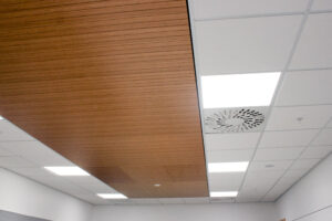 Decortech multigroove panels with T & R Phonic Absorb 600x600 ceiling tiles in Rondo DONN Grid